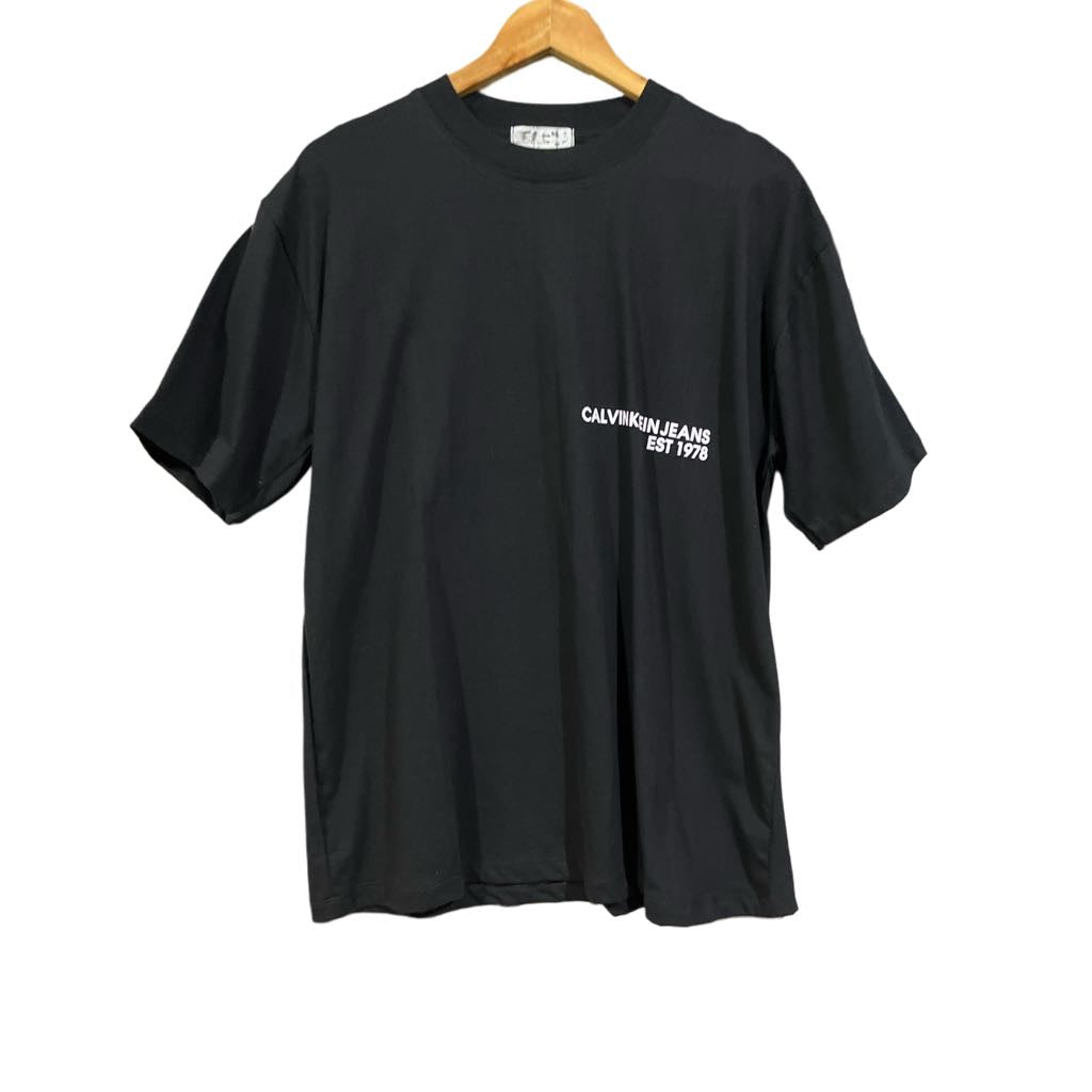 C. Kle!n Oversized Tee