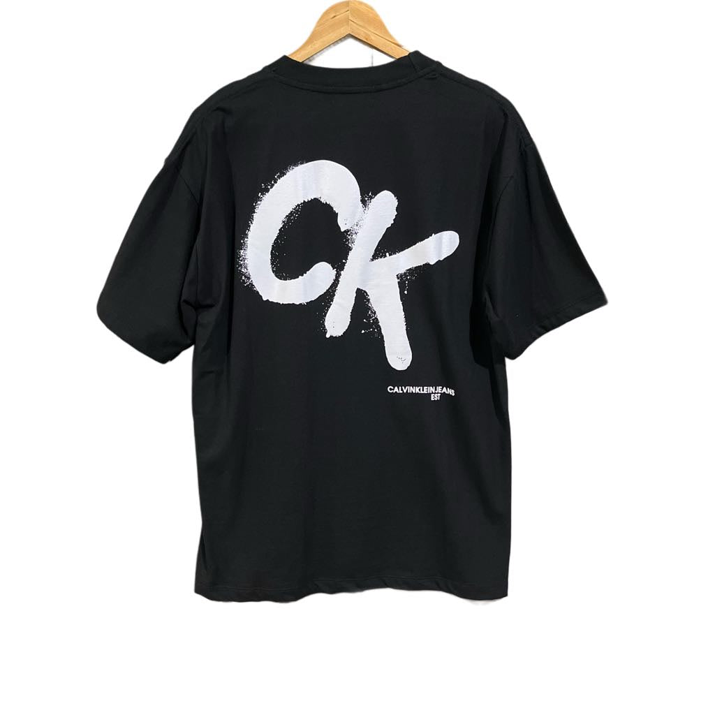 C. Kle!n Oversized Tee